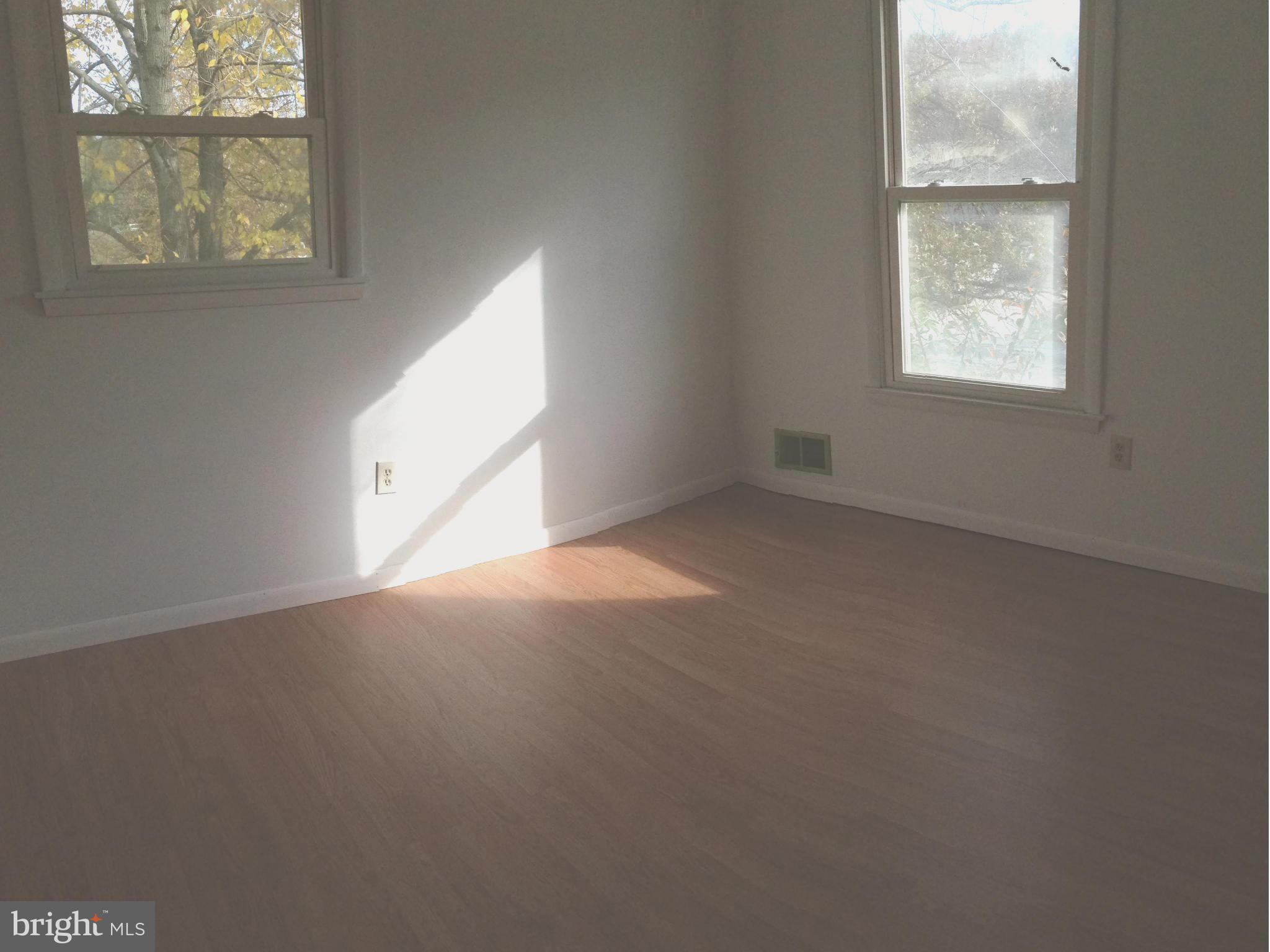 1616 Hopefield Road Silver Spring, MD 20905 - Photo 14 of 22 an empty room with a window