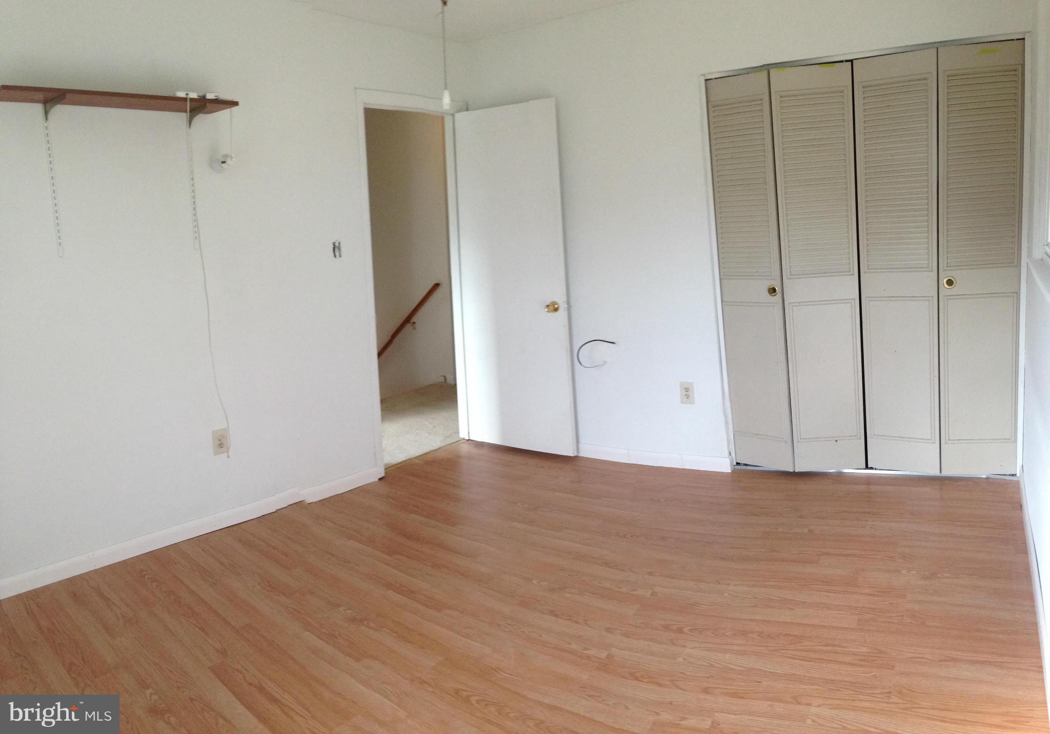 1616 Hopefield Road Silver Spring, MD 20905 - Photo 17 of 22 a view of an empty room with wooden floor