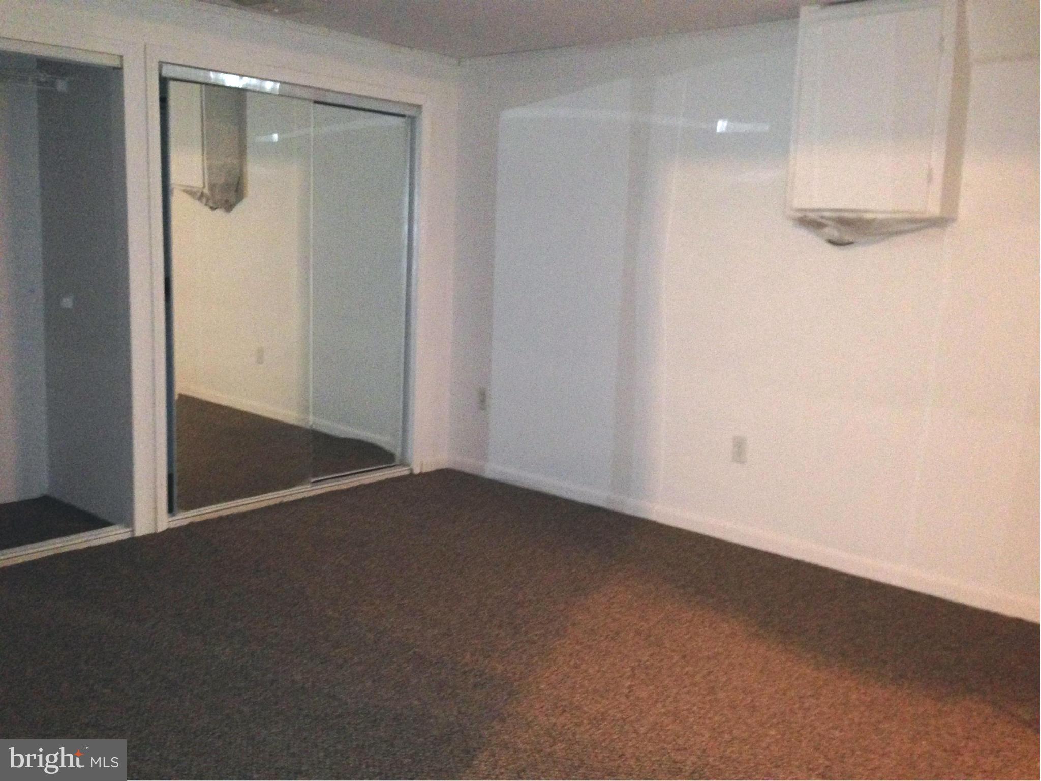 1616 Hopefield Road Silver Spring, MD 20905 - Photo 21 of 22 an empty room with windows in it