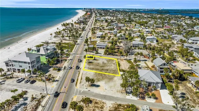 a view of a swimming pool with a patio and a yard