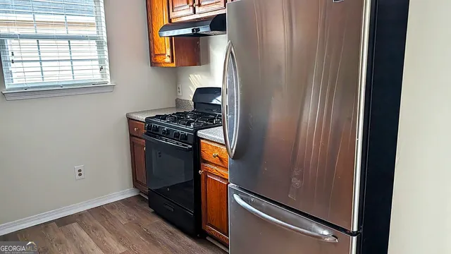 a utility room with closet dryer and washer