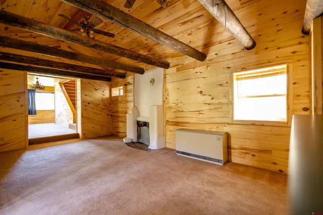 a view of a room with large windows