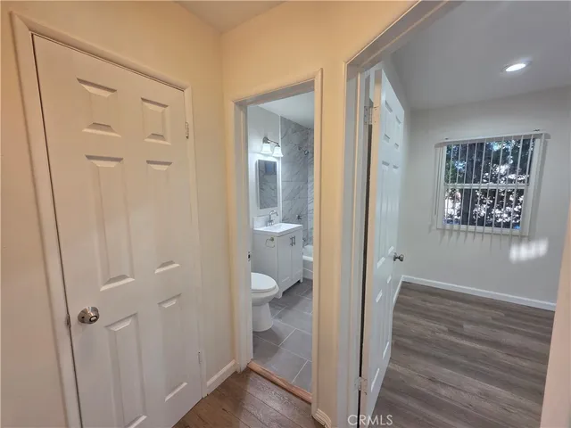 a view of room with window and bathroom