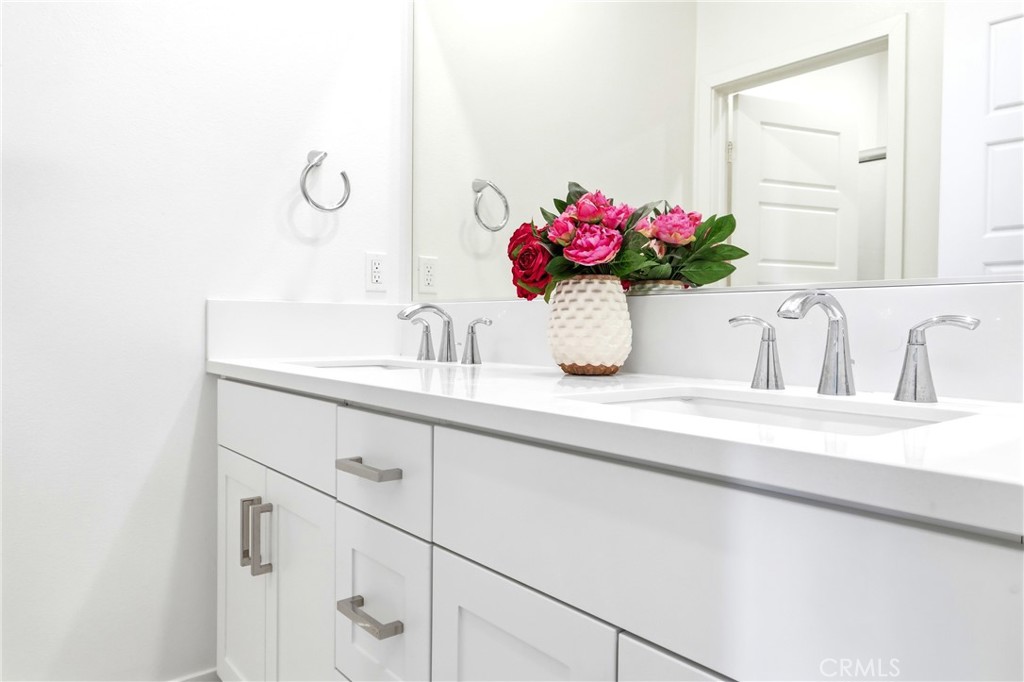253 Waypoint Tustin, CA 92782 - Photo 44 of 56 hall bathroom with dual sinks.