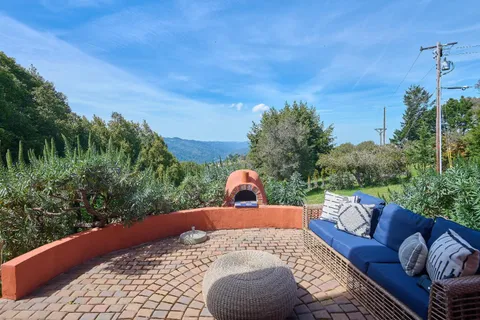 a view of a balcony with furniture
