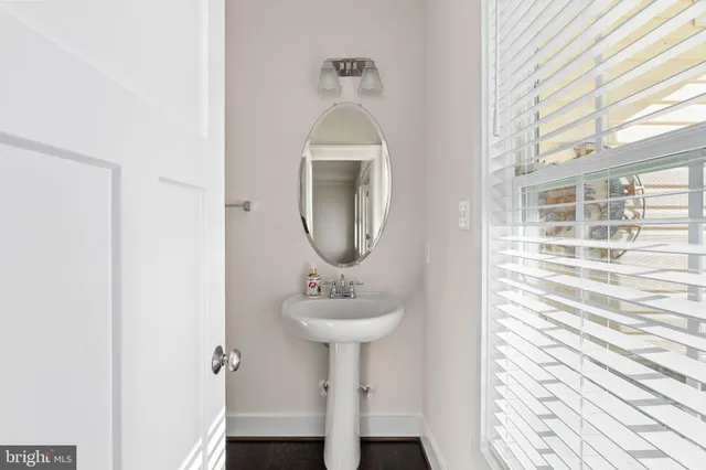 a kitchen with kitchen island granite countertop a stove a sink a center island a stove and a cabinets