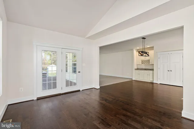 a bathroom with a granite countertop toilet and a sink