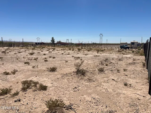 a view of a road with a building in the background