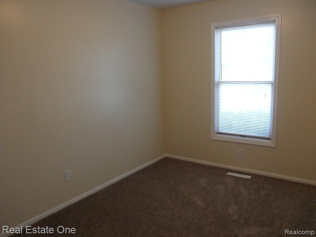8240 Torrey Road Grand Blanc, MI 48439 - Photo 12 of 32 Entry level Bedroom facing front, could also make a great office or den