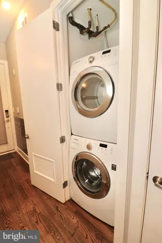 a view of a hallway with washer and dryer