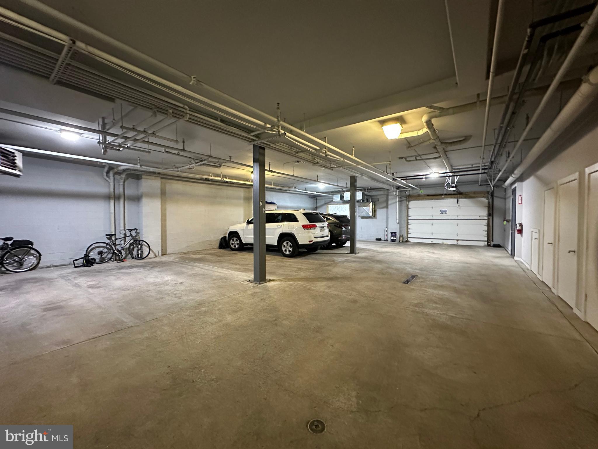 1233 Bainbridge Street, Unit H Philadelphia, PA 19147 - Photo 20 of 24 a view of parking garage with cars