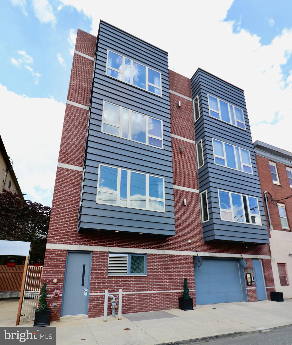 1233 Bainbridge Street, Unit H Philadelphia, PA 19147 - Photo 22 of 24 a building view with a brick wall