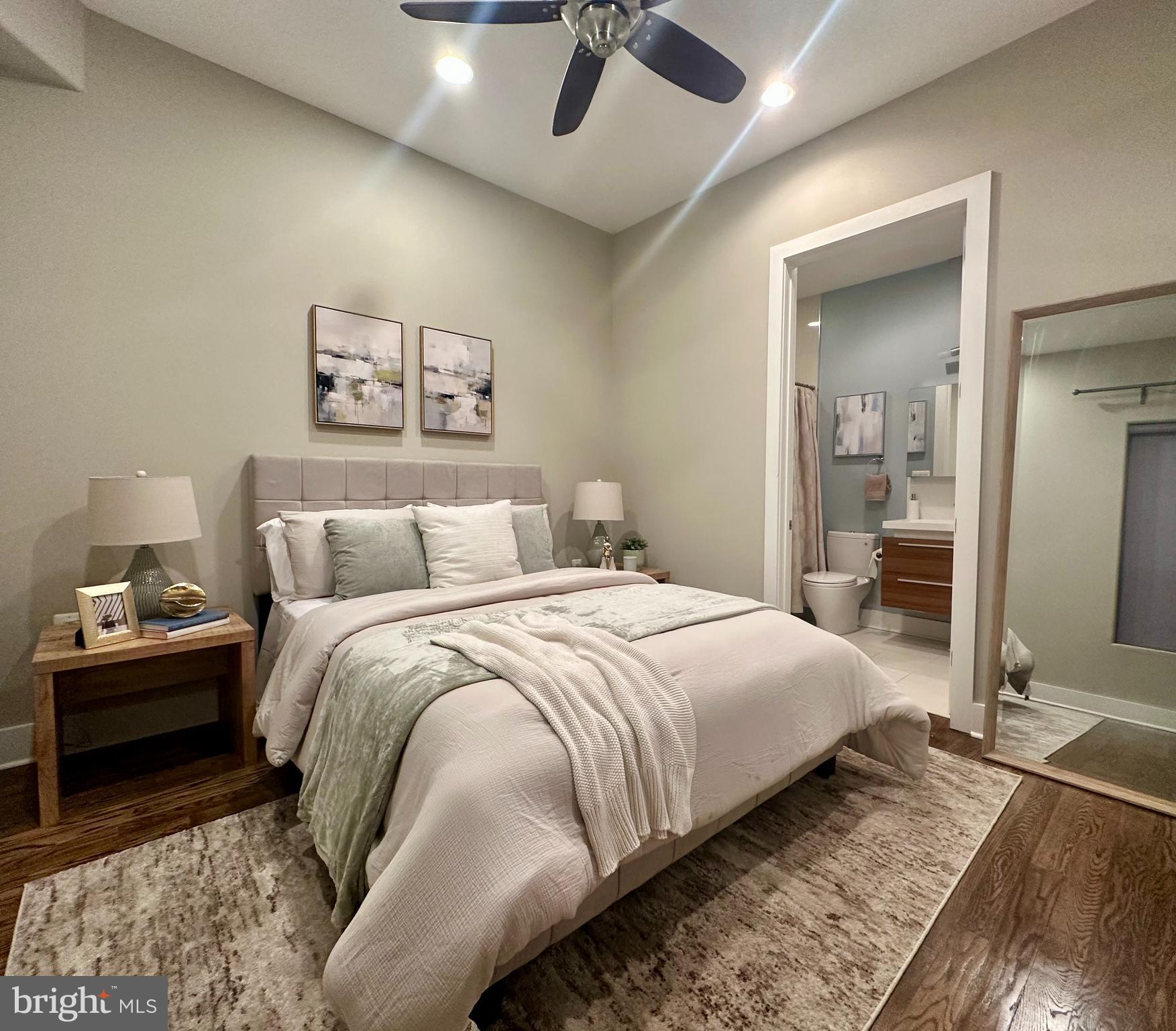 1233 Bainbridge Street, Unit H Philadelphia, PA 19147 - Photo 7 of 24 a bedroom with bed and window