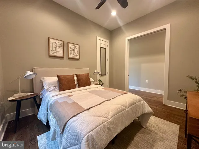 a bedroom with bed and window