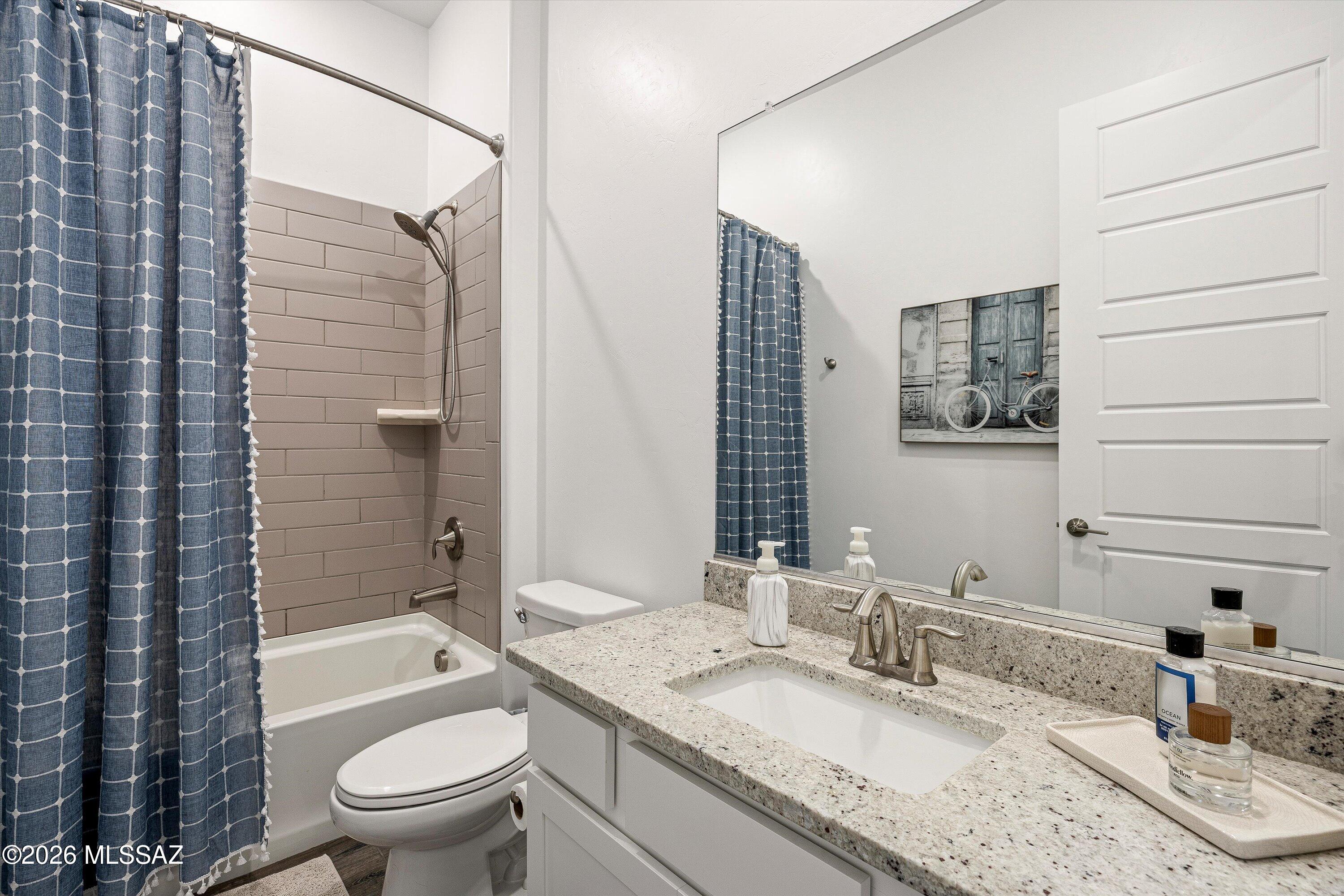 5196 West Ridgemont Court Tucson, AZ 85742 - Photo 35 of 46 Guest bathroom #2 features tub, shower, and granite countertop
