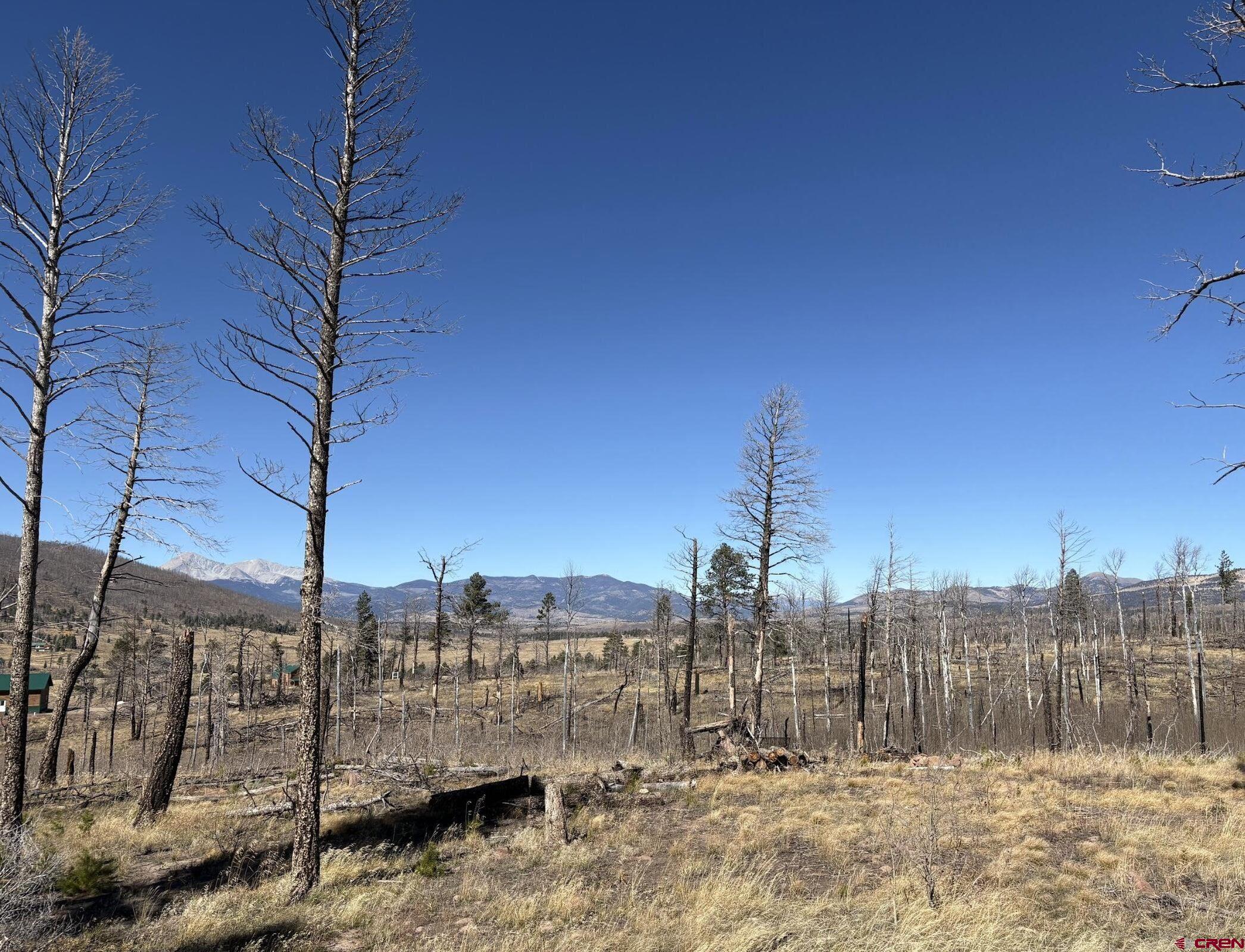 a view of a house with a snow in the yard