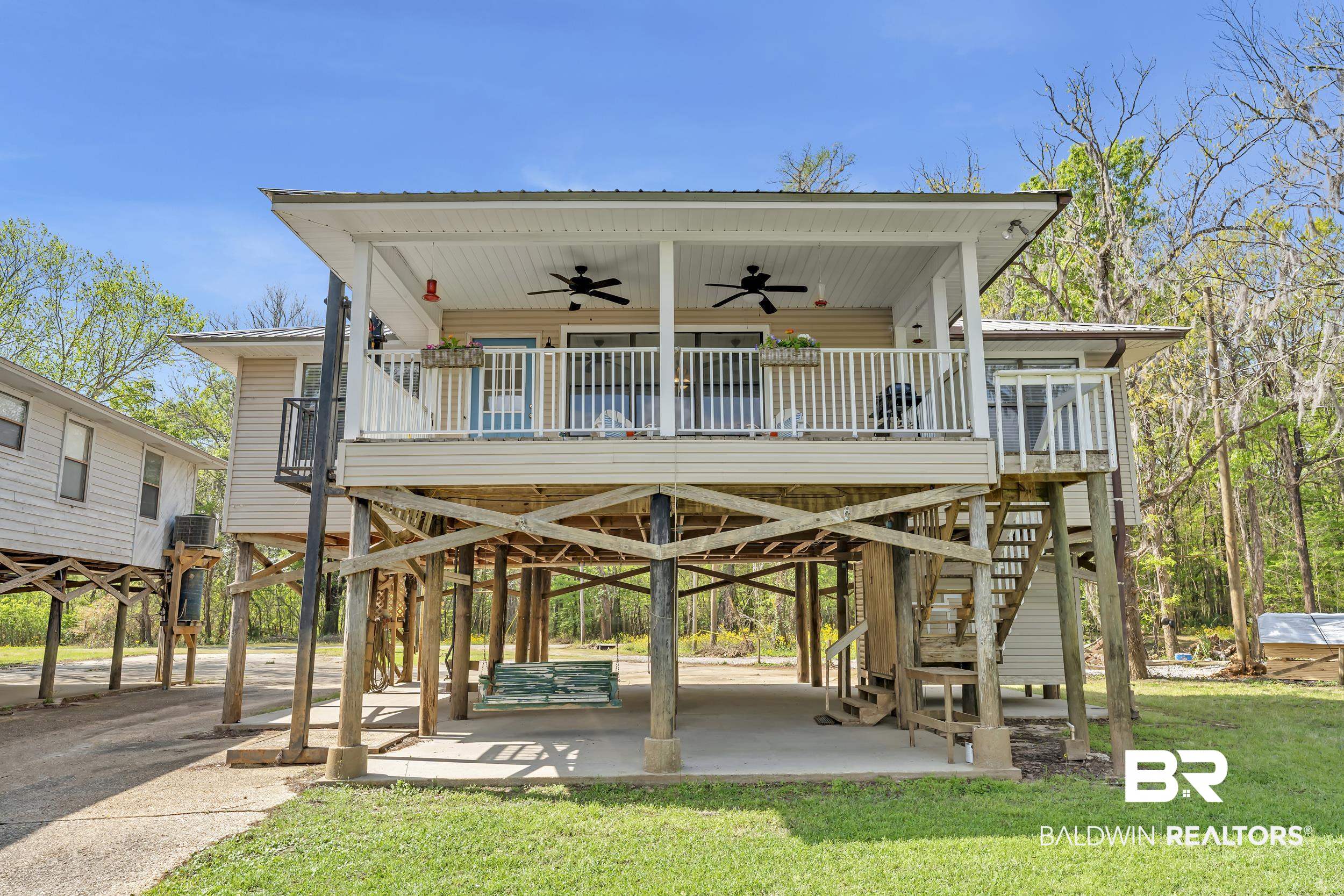 8081 Bryant's Lndg Road Stockton, AL 36579 - Photo 6 of 48 View of community with a carport and a wooden deck