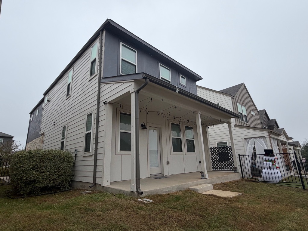 7417 Acela Trail, Unit 231 Austin, TX 78744 - Photo 13 of 15 Back of house featuring a patio