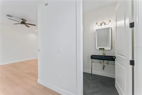 a view of staircase with wooden floor and windows