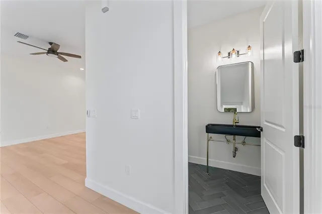a view of staircase with wooden floor and windows