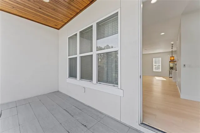 a view of a balcony with wooden floor