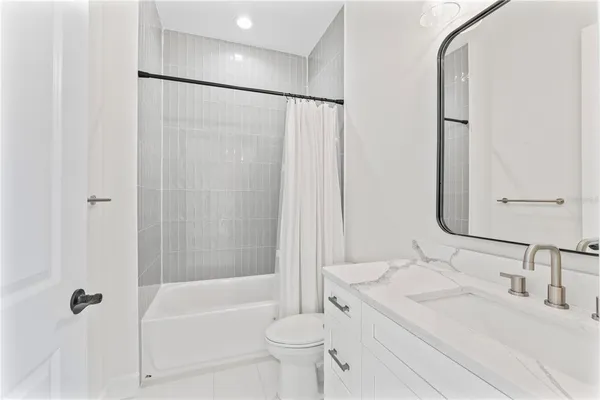 a view of a yard with flower plants