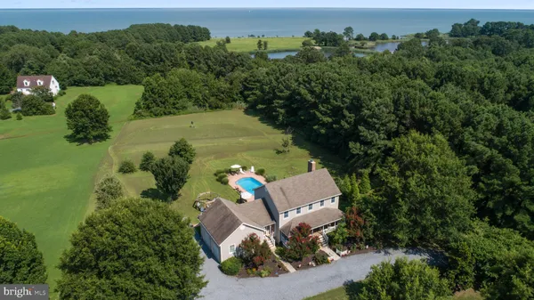 an aerial view of a house with outdoor space