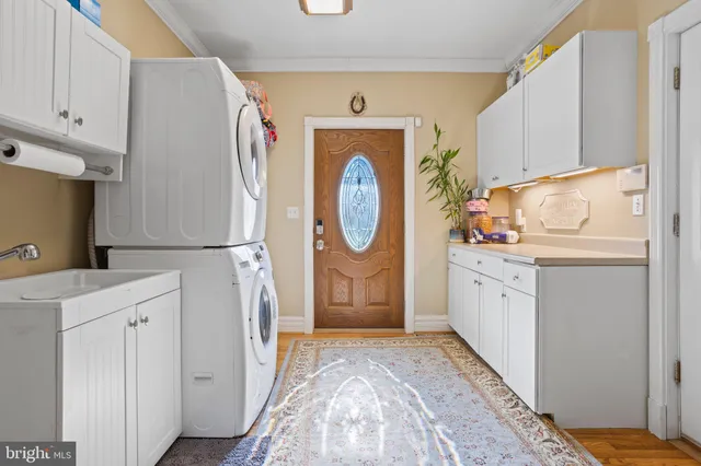 a hallway with washer and dryer