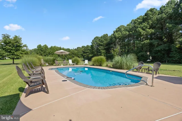 a view of a swimming pool with a patio