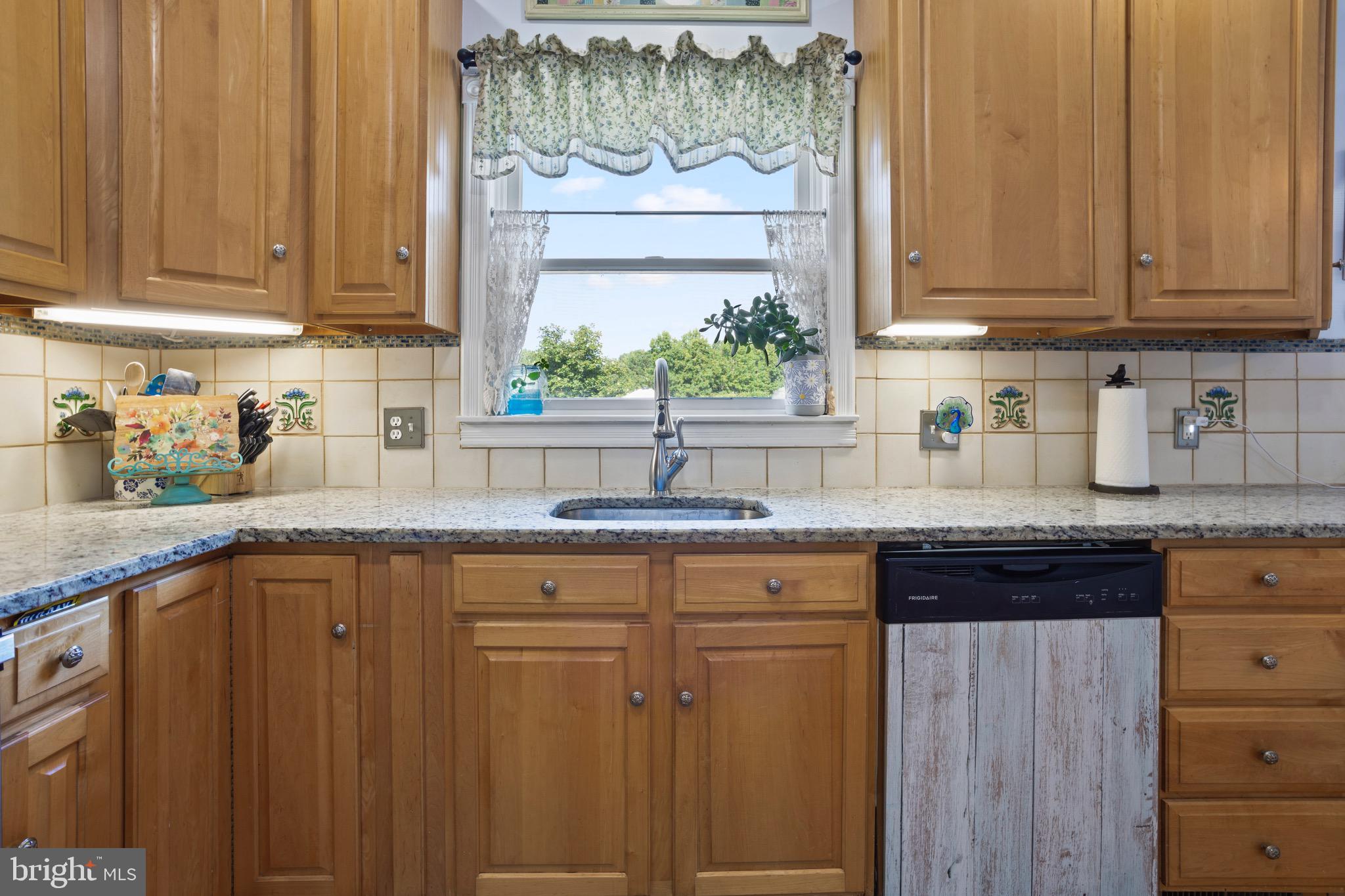 4957 Bar Neck Road Tilghman, MD 21671 - Photo 21 of 45 Over the sink view of the beautiful backyard