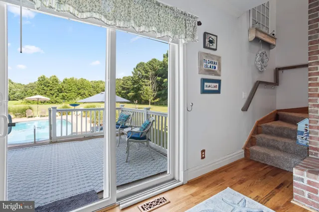 a view of a balcony with wooden floor and outdoor space