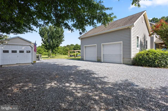 a view of a house with a yard and garage