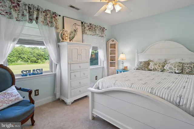 a bathroom with a sink a vanity and a window