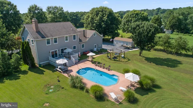 a view of a patio with a table and chairs