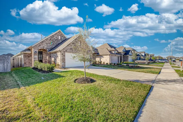 a swimming pool with outdoor seating and yard