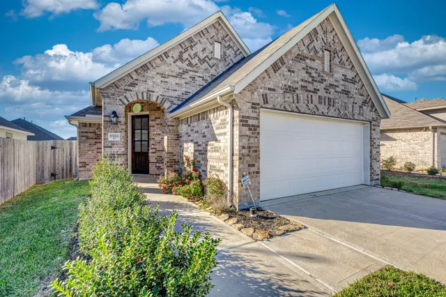 a view of a house with backyard porch and sitting area