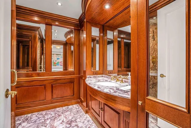 a bathroom with a sink and mirror