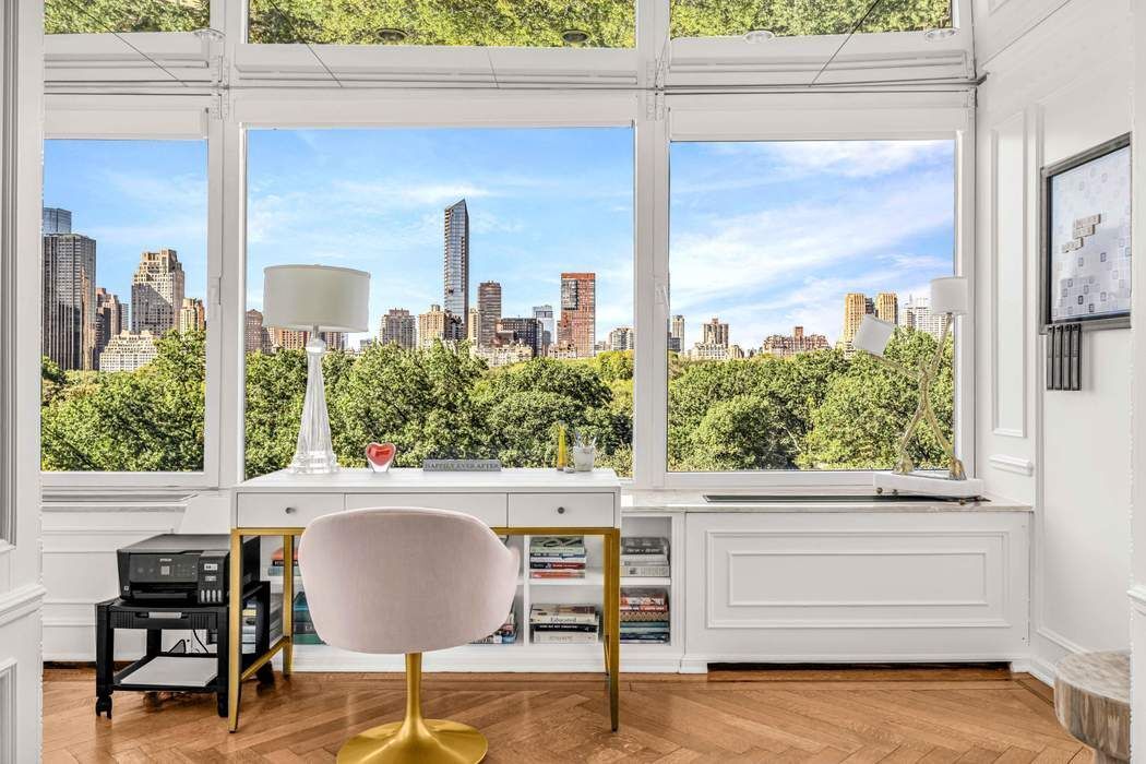 860 5th Avenue, Unit 9/10JK Manhattan, NY 10065 - Photo 5 of 19 a living room with a large window and a table