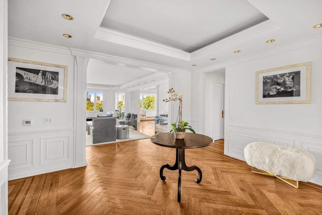 860 5th Avenue, Unit 9/10JK Manhattan, NY 10065 - Photo 8 of 19 a living room with furniture and wooden floor