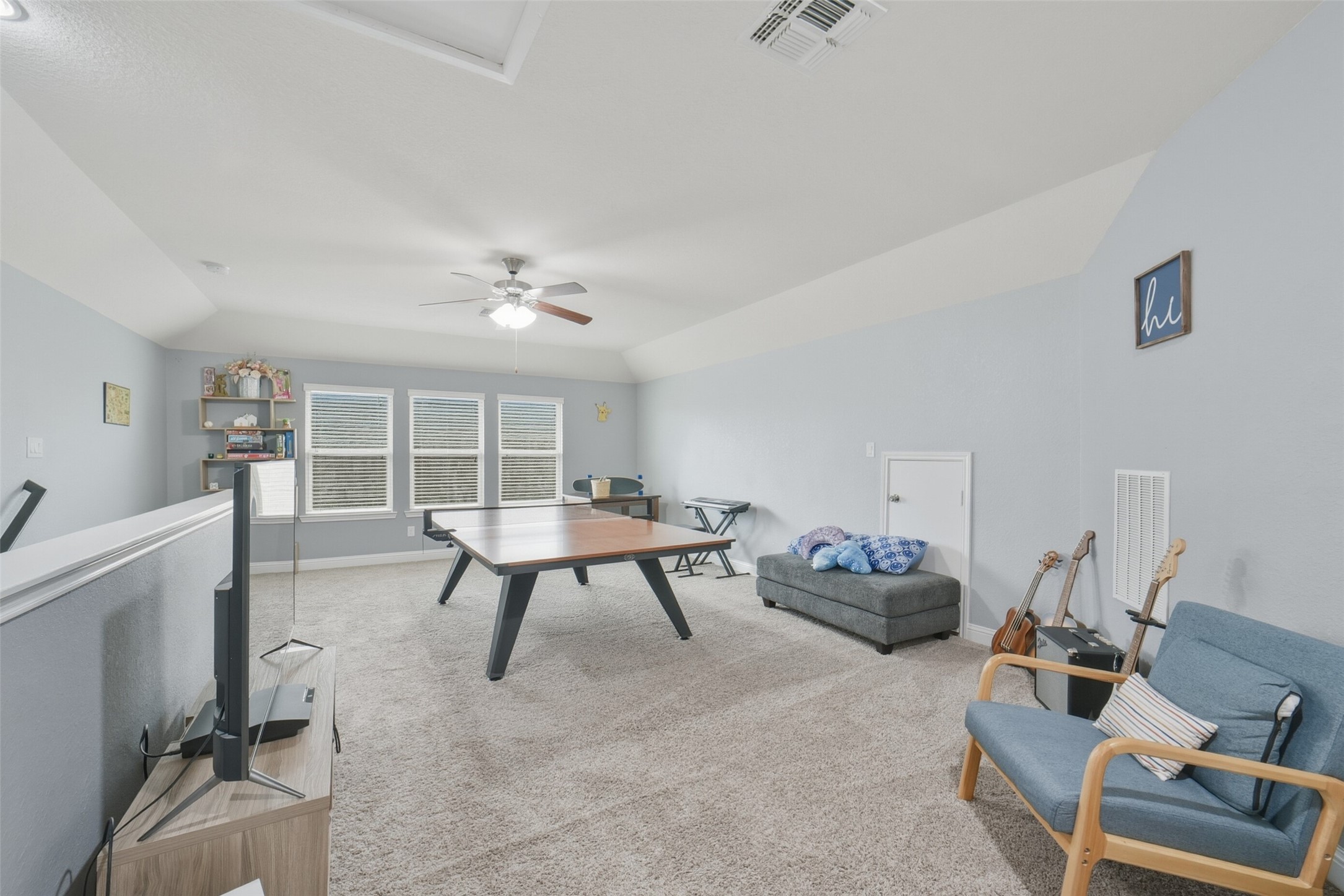 30014 Valley Terrace Drive Fulshear, TX 77406 - Photo 25 of 36 The game room is light and bright from the three double pane windows.
