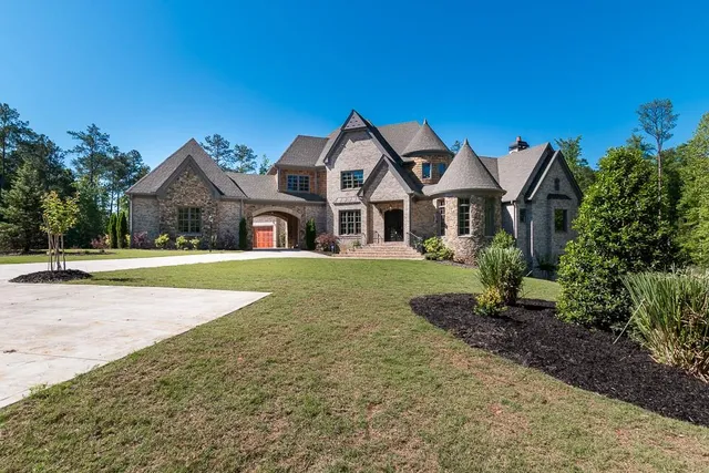 a front view of a house with a yard