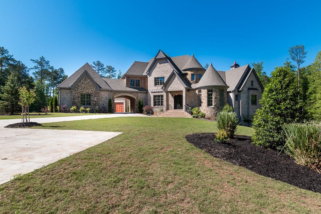 a front view of a house with a yard