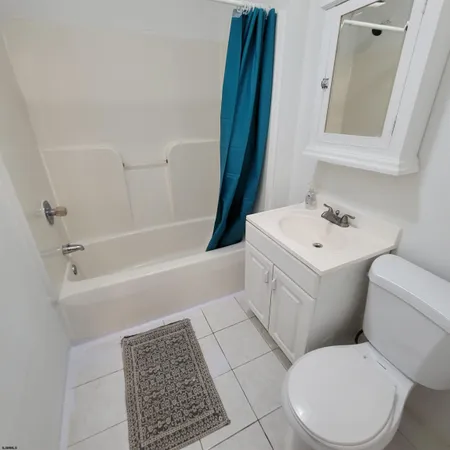 a bathroom with a sink toilet and a vanity