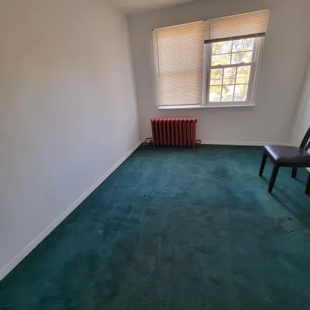 a view of a porch with wooden floor