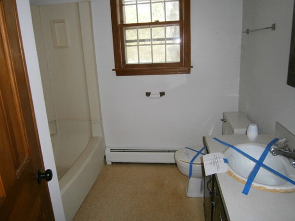 20 Dexter Street Eastham, MA 02642 - Photo 12 of 14 a view of a room with rack on the wall and a window