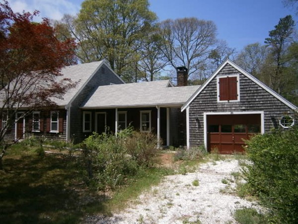 20 Dexter Street Eastham, MA 02642 - Photo 5 of 14 a front view of a house with garden
