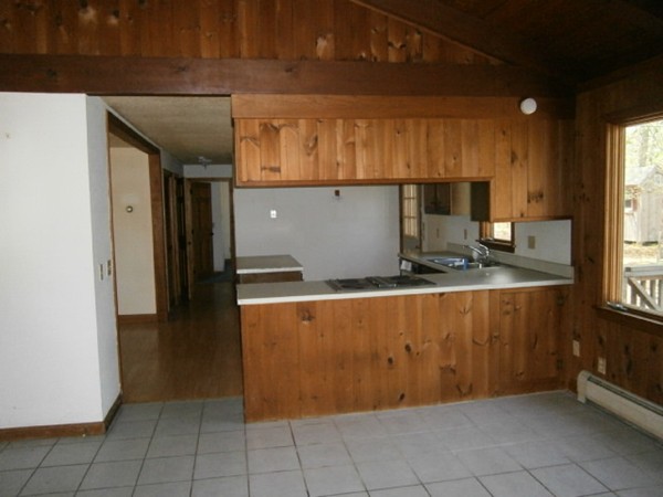 20 Dexter Street Eastham, MA 02642 - Photo 7 of 14 a kitchen with granite countertop a sink and cabinets