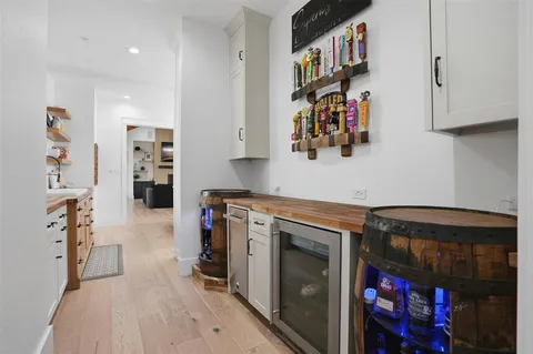 a kitchen with stainless steel appliances granite countertop a stove and cabinets