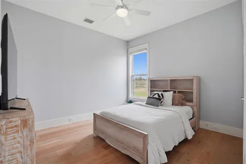 a bed room with a bed and a tv