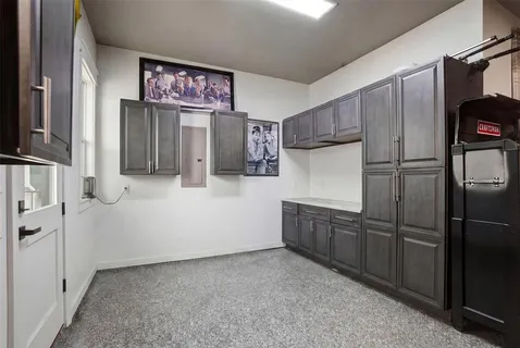 a kitchen with cabinets and stainless steel appliances